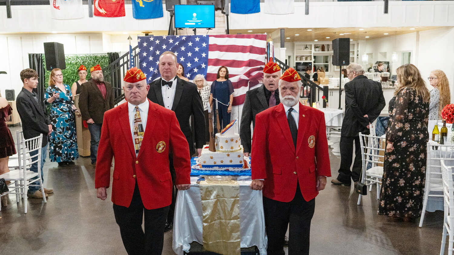 Carrying the birthday cake for the Marine Corps League Wood County detachment’s annual ball recently were, from left, Jr. Vice Commandant Wesley Marsh, Ted Willison, Sgt. Jim Biesheuvel and Sergeant-at-arms Jim Bailey. Honored guests traditionally receive the first slices, and this year’s were Gold Star mothers Brenda Powell and Teresa Melton and Gold Star sister Misty Goldman.